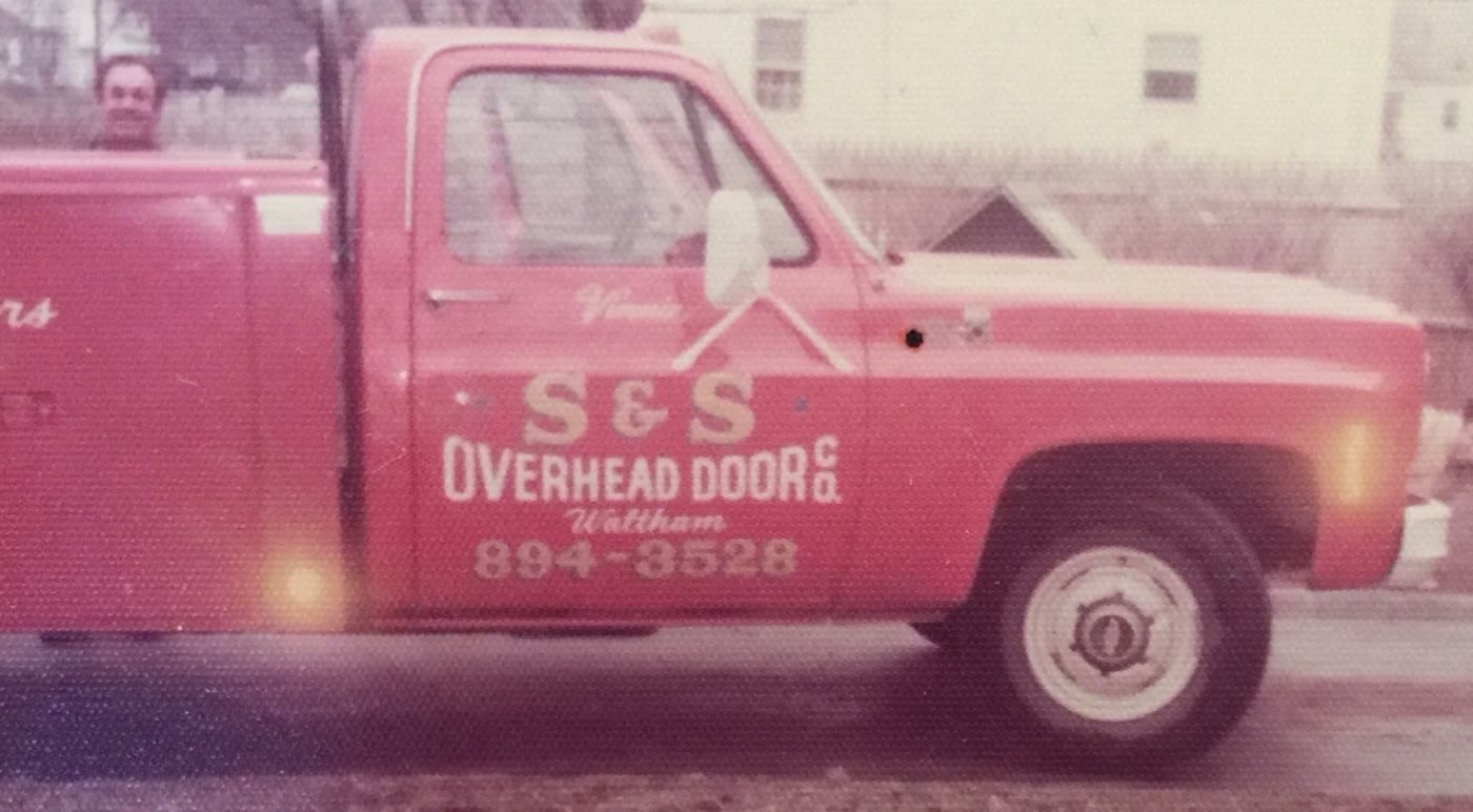 Vinnie's S and S Overhead Door pickup, hand lettered with Waltham and the phone number 894-3528